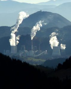 Power plant with various emissions being produced, from le-si of FreeImages.com
