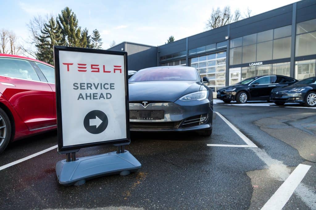 Tesla service ahead sign outside a dealership in Germany