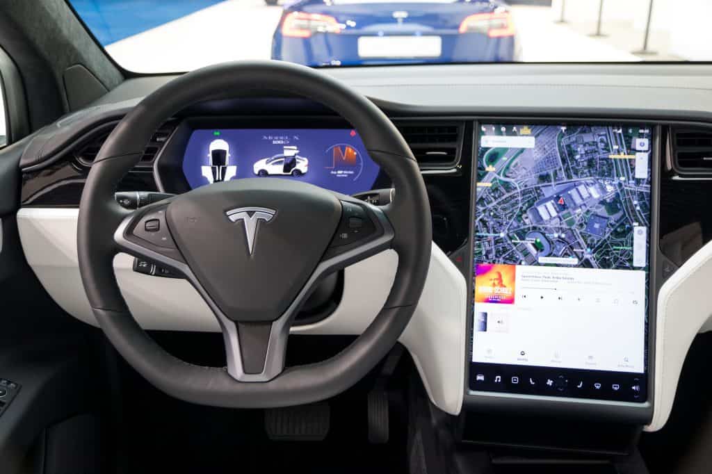 The interior of a Tesla Model X with black and white trim