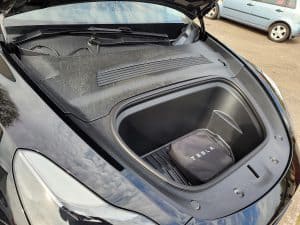 A Tesla Offer Frunk Kit inside the frunk of a Tesla Model Y