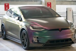 A wrapped Tesla Model X with galaxy color wrapping effect