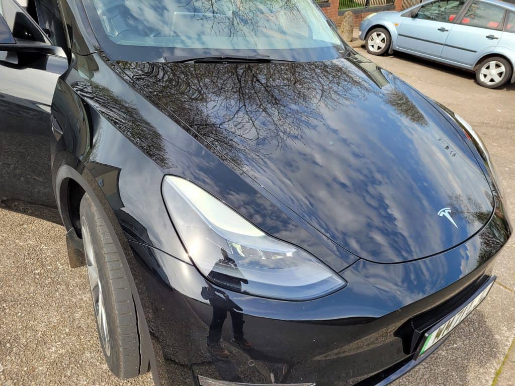 The front of a black Tesla Model Y