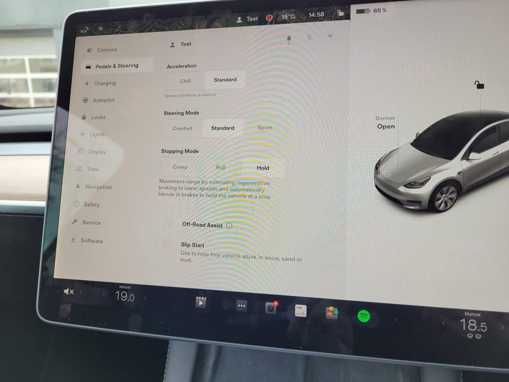 The pedals and steering options of a Tesla Model Y including acceleration and steering mode options