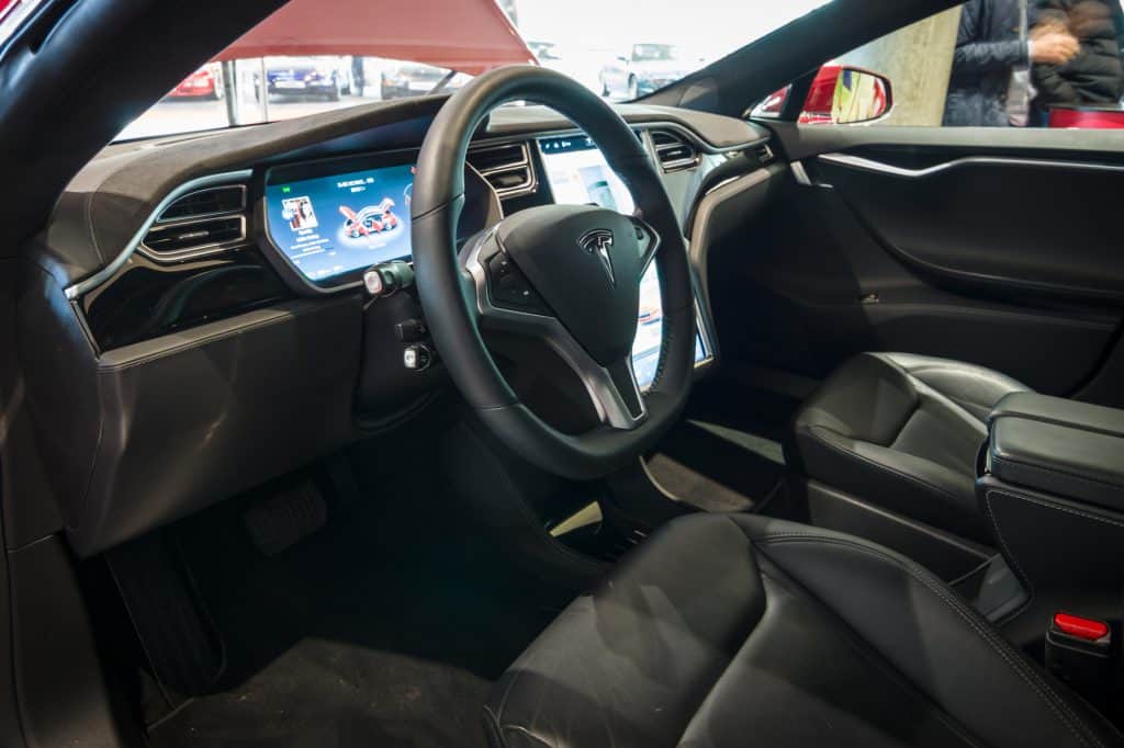 Cabin of a Tesla Model S showing the glove compartment touchscreen and more